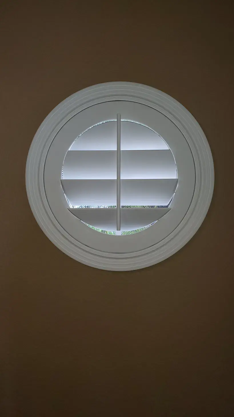 Round porthole window plantation shutters