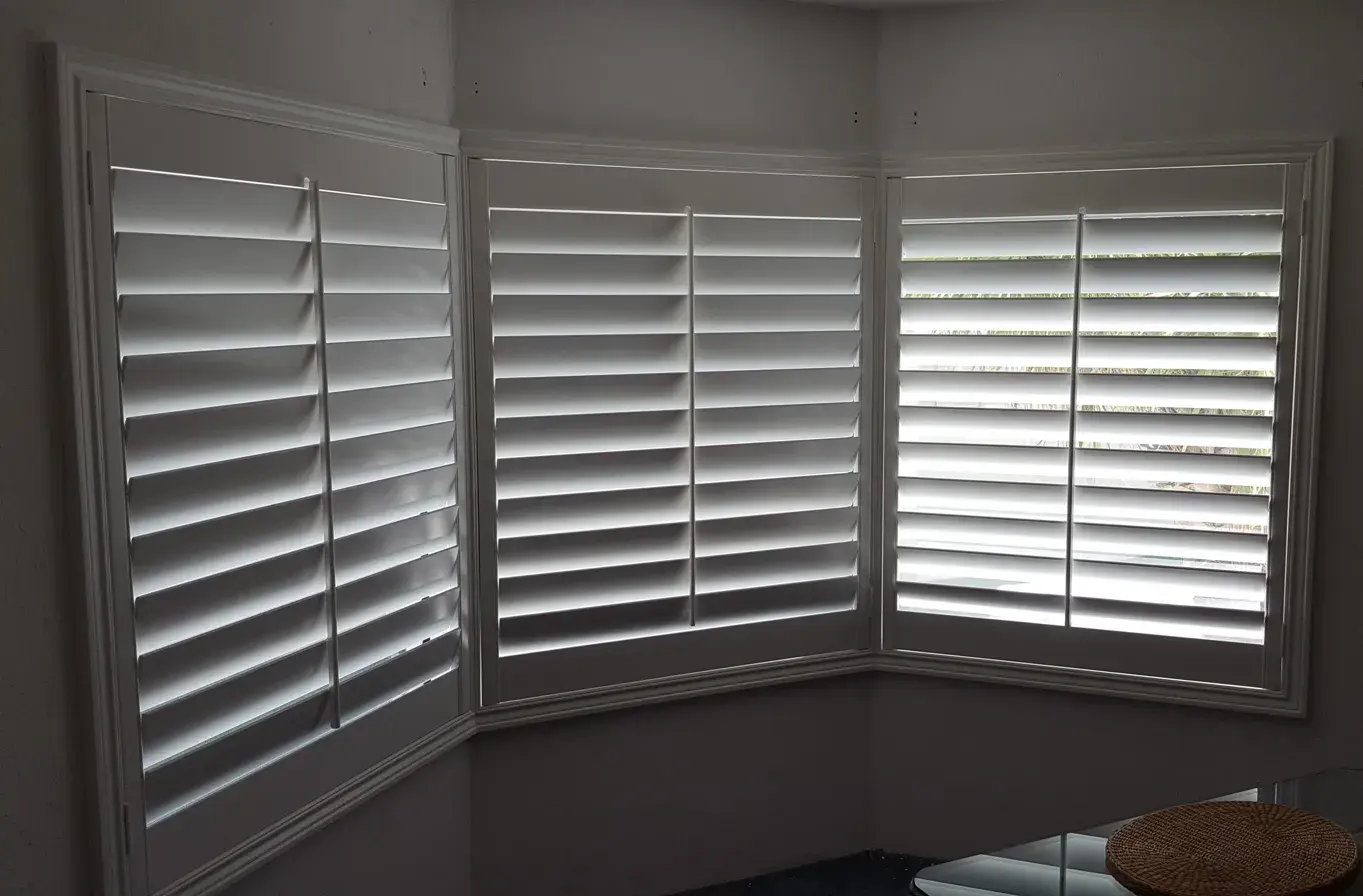 Corner bay window shutters in living room